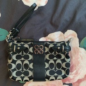 Small black “Signature C” Coach clutch/wristlet